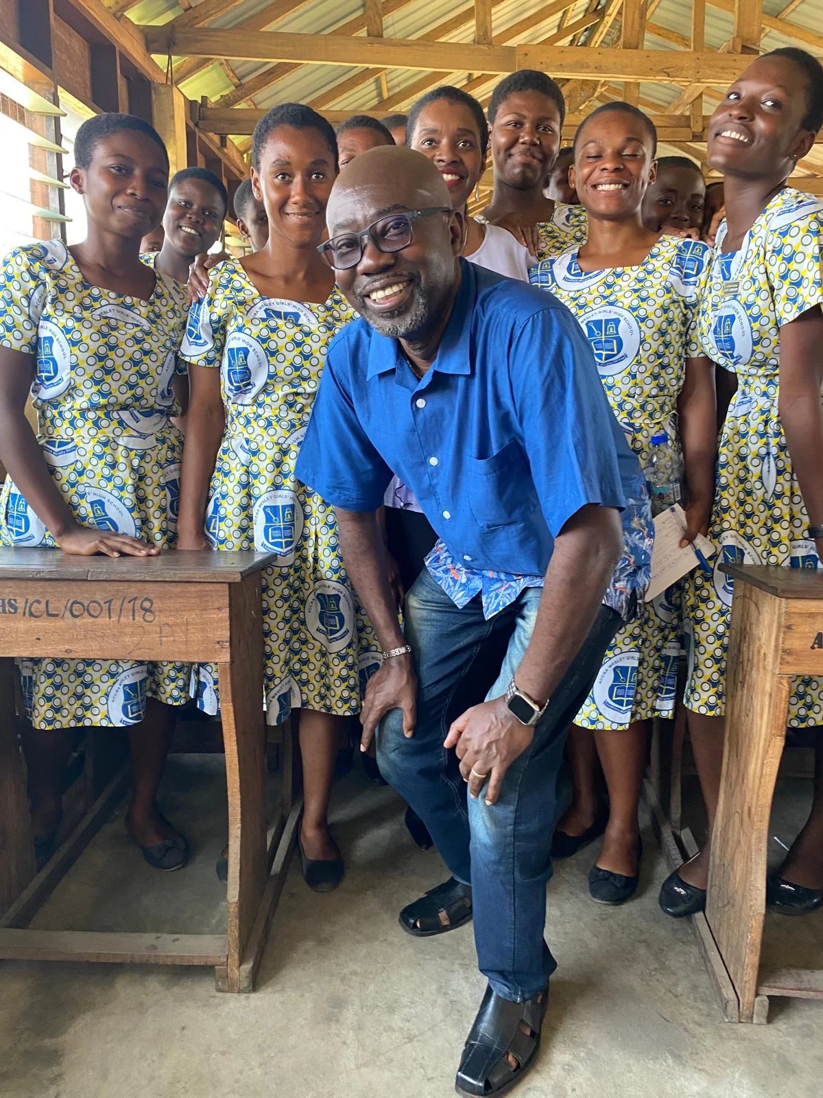 Bishop Fred Adetunji with a group of students